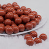 front view of a pile of 16mm Cocoa Brown Solid Acrylic Bubblegum Jewelry Beads