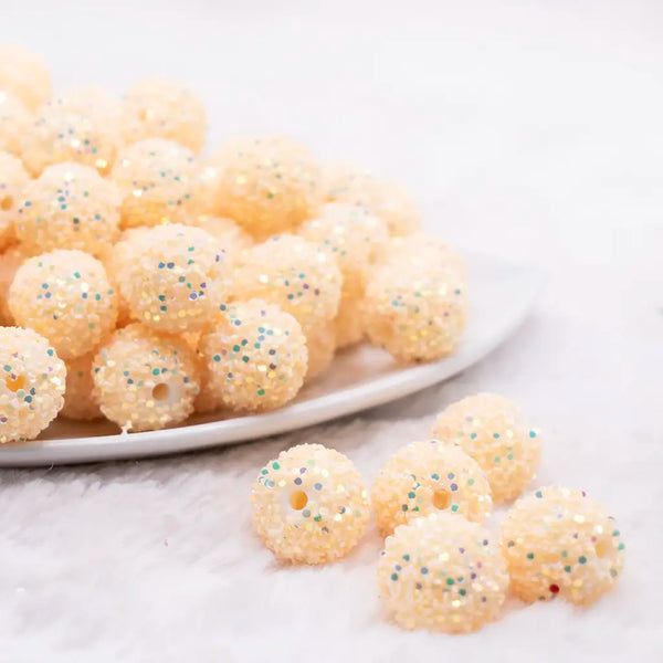 front view of a pile of 16mm Cream Yellow Sequin Confetti Bubblegum Beads