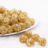 front view of a pile of 16mm Gold Sequin Confetti Bubblegum Beads