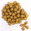 top view of a pile of 16mm Gold Glitter Twinkle Bubblegum Beads
