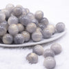 front view of a pile of 16mm Gray Luster Bubblegum Beads
