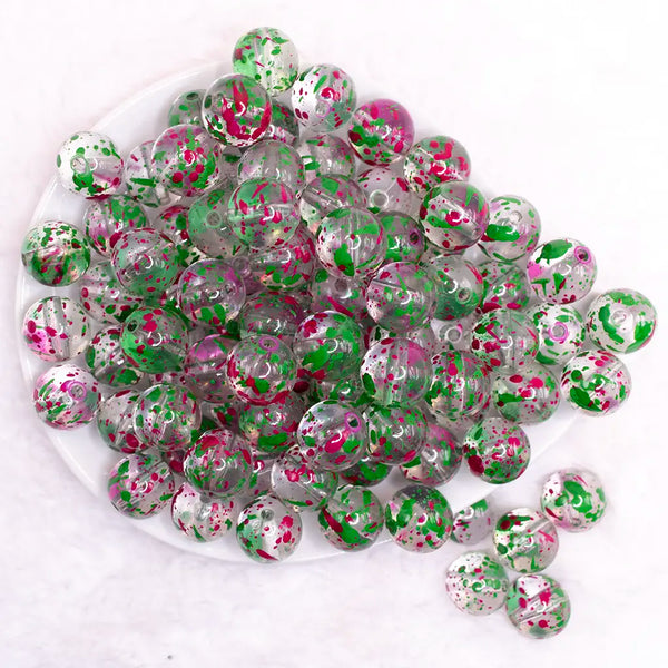 top view of a pile of 16mm Green and Hot Pink Splatter Bubblegum Bead