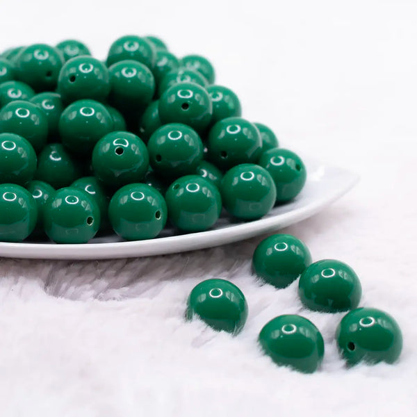 front view of a pile of 16mm Green Solid Acrylic Bubblegum Jewelry Beadsx