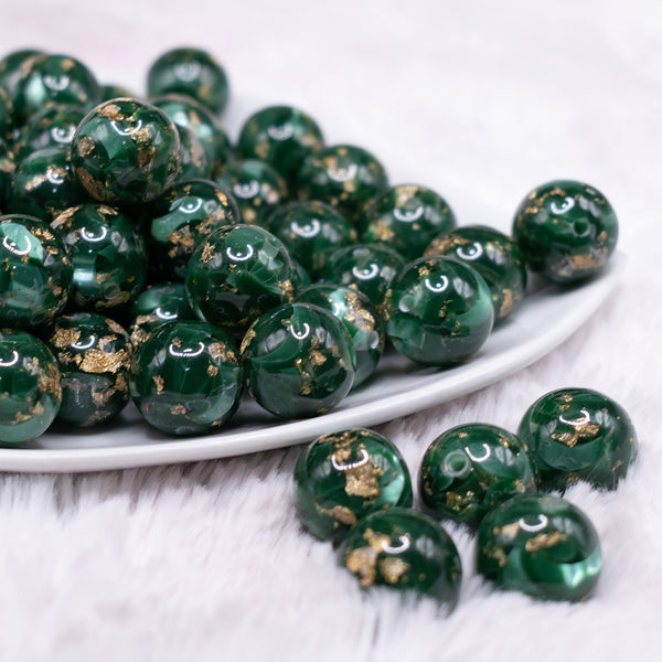 front view of a pile of 16mm Green with Gold Flake Acrylic Chunky Bubblegum Beads