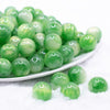front view of a pile of 16mm Green Luster Bubblegum Beads