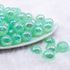 front view of a pile of 16mm Green Opalescence Bubblegum Bead