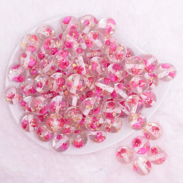 top view of a pile of 16mm Hot Pink Flaked Flower Bubblegum Bead