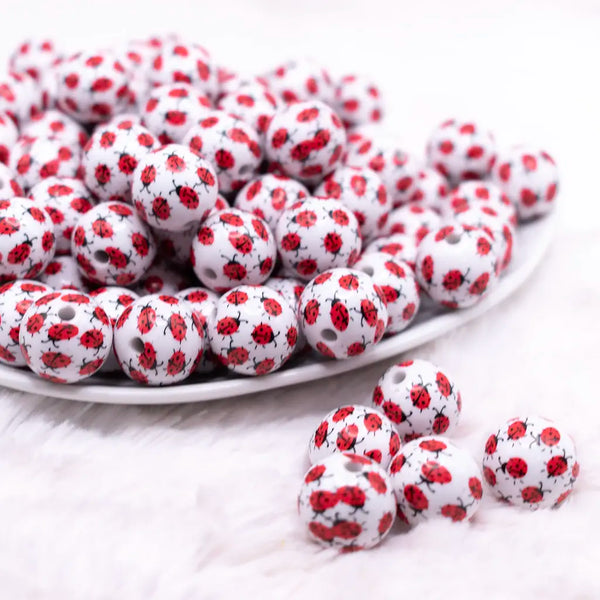 front view of a pile of 16mm Ladybug Print Bubblegum Bead