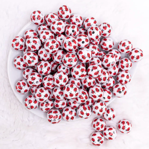 top view of a pile of 16mm Ladybug Print Bubblegum Bead