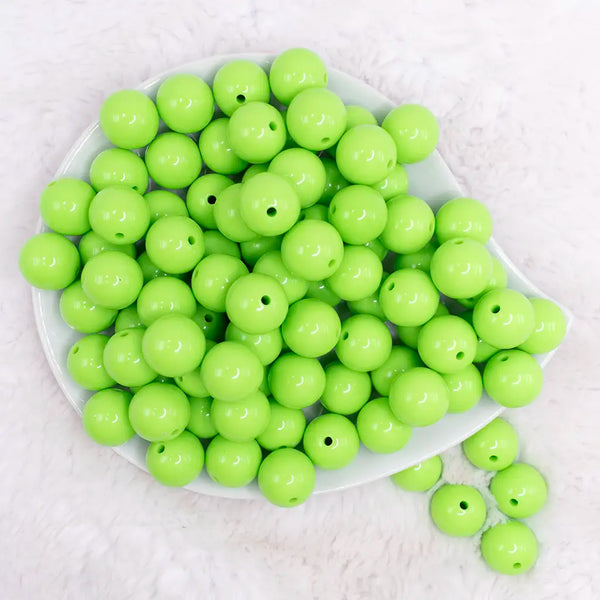 top view of a pile of 16mm Lawn Green Solid Acrylic Bubblegum Jewelry Beads