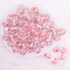 top view of a pile of 16mm Light Pink Flaked Flower Bubblegum Bead