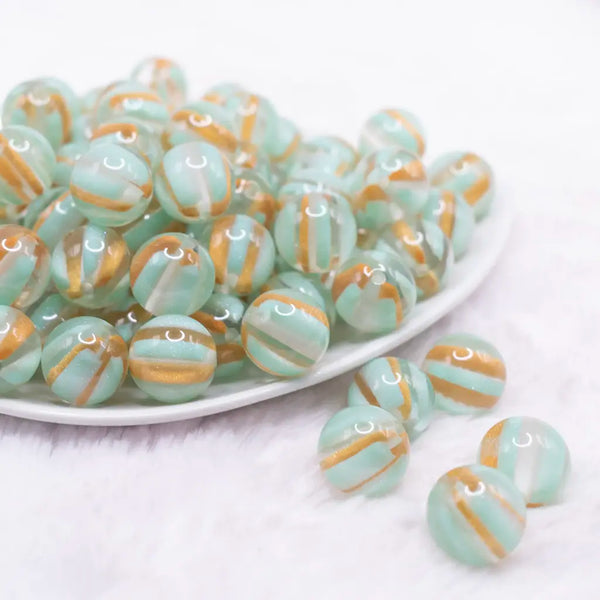 front view of a pile of 16mm Mint Green Cats Eye Acrylic Bubblegum Beads