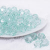 front view of a pile of 16mm Mint Green Transparent Faceted Bubblegum Beads
