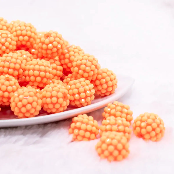 front view of a pile of 16mm Orange on Orange Rhinestone Bubblegum Beads