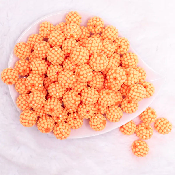 top view of a pile of 16mm Orange on Orange Rhinestone Bubblegum Beads