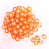 top view of a pile of 16mm Orange Frosted Pumpkin Shaped Bubblegum Bead