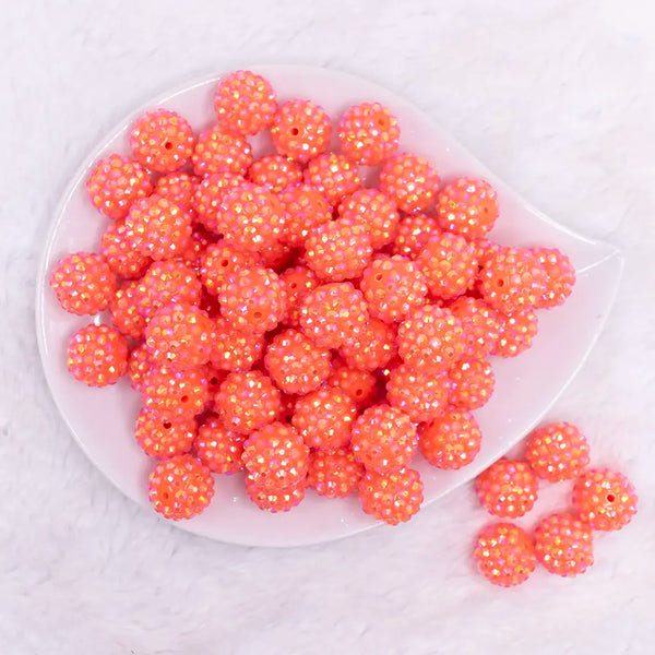 top view of a pile of 16mm Orange Neon Rhinestone AB Bubblegum Beads