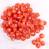 top view of a pile of 16mm Orange Rose Bubblegum Beads