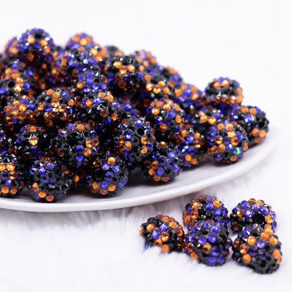 front view of a pile of 16mm Orange, Purple and Black Confetti Rhinestone Chunky Bubblegum Beads