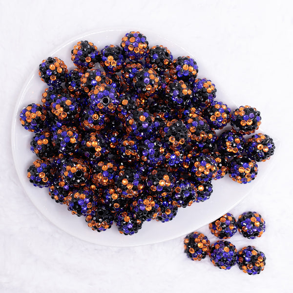 top view of a pile of 16mm Orange, Purple and Black Confetti Rhinestone Chunky Bubblegum Beads