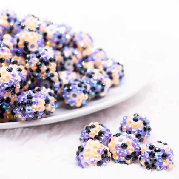 front view of a pile of 16mm Orange, Purple and Black Confetti Rhinestone Bubblegum Beads