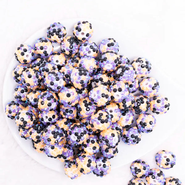top view of a pile of 16mm Orange, Purple and Black Confetti Rhinestone Bubblegum Beads