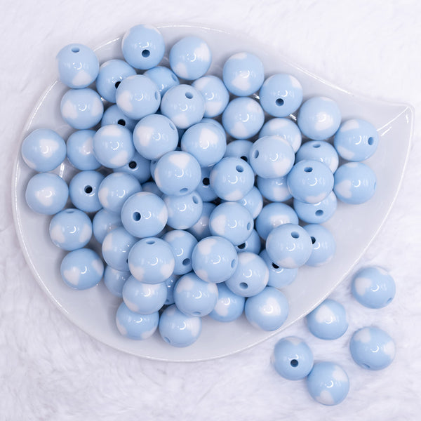 top view of a pile of 16mm Pastel Blue with White Hearts Bubblegum Beads