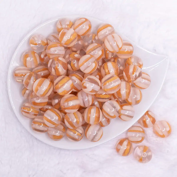 top view of a pile of 16mm Peach Cats Eye Acrylic Bubblegum Beads
