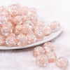 front view of a pile of 16mm Peach Rose Bubblegum Beads
