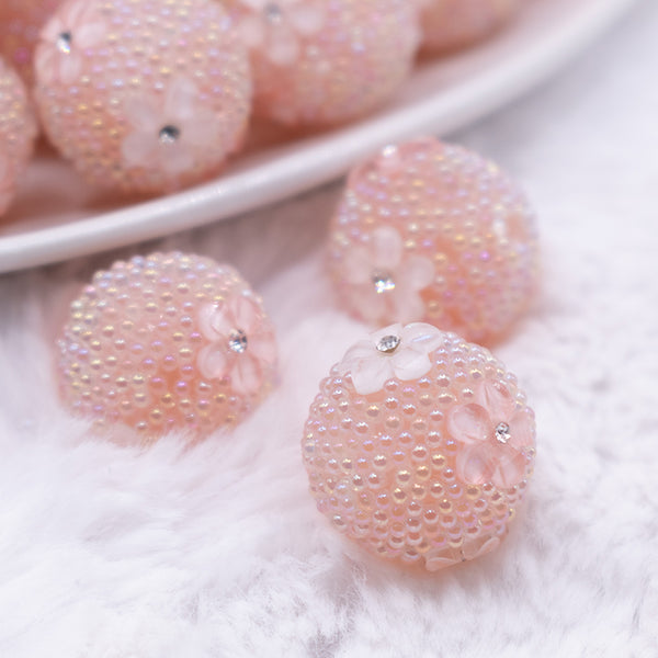 close up view of a pile of 16mm Peach with Peach Flowers luxury acrylic beads