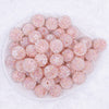 top view of a pile of 16mm Peach with Peach Flowers luxury acrylic beads