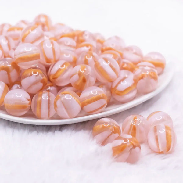 front view of a pile of 16mm Pink Cats Eye Acrylic Bubblegum Beads