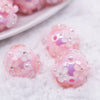 close up view of a pile of 16mm Pink Floral Bliss luxury acrylic beads