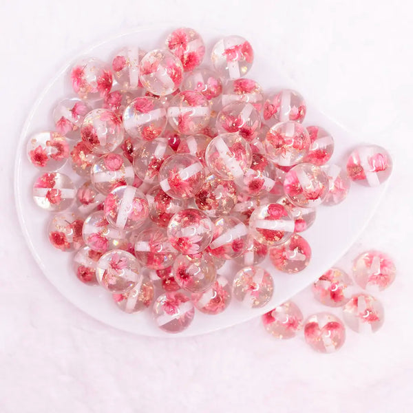 top view of a pile of 16mm Pink Flaked Flower Bubblegum Bead