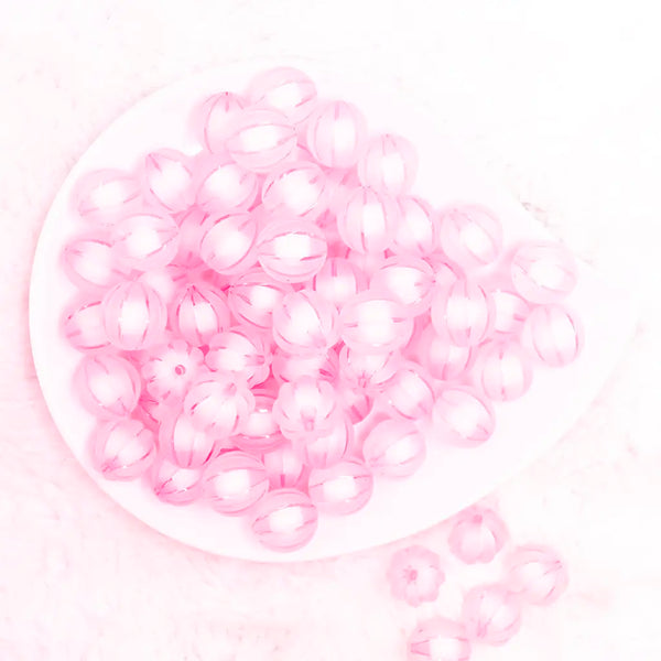 top view of a pile of 16mm Pink Frosted Pumpkin Shaped Bubblegum Bead