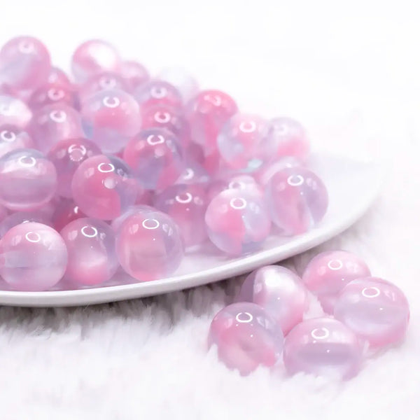 front view of a pile of 16mm Pink Illusion Glitter Bubblegum Bead