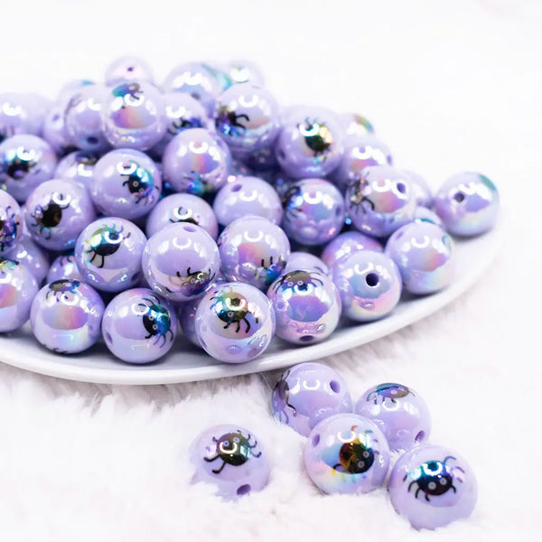 front view of a pile of 16mm Purple AB with Spider Print Bubblegum Beads
