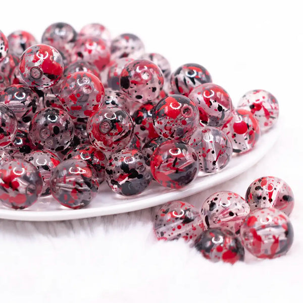 front view of a pile of 16mm Red and Black Splatter Bubblegum Bead