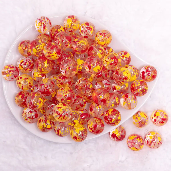 top view of a pile of 16mm Red and Yellow Splatter Bubblegum Bead