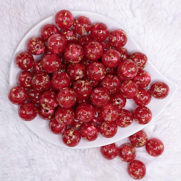 top view of a pile of 16mm Red with Gold Flake Acrylic Chunky Bubblegum Beads