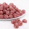 front view of a pile of 16mm Red Glitter Twinkle Bubblegum Beads