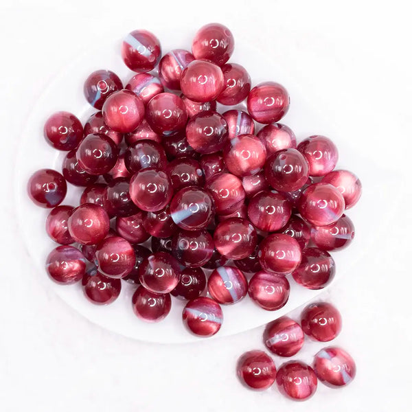 top view of a pile of 16mm Red Illusion Glitter Bubblegum Bead