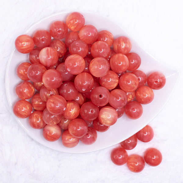 top view of a pile of 16mm Red Luster Bubblegum Beads