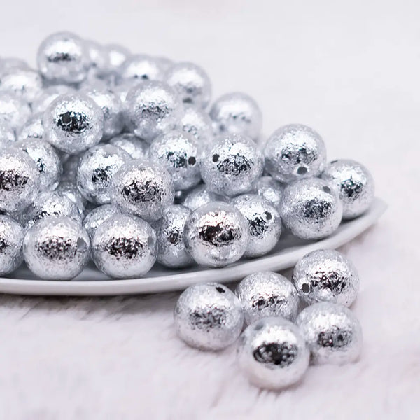 front view of a pile of 16mm Silver Crinkle Foil Bubblegum Beads