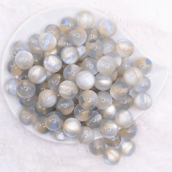 top view of a pile of 16mm Slate Blue Illusion Glitter Bubblegum Bead