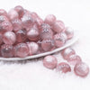 front view of a pile of 16mm Tea Rose Illusion Glitter Bubblegum Bead