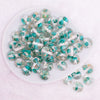 top view of a pile of 16mm Teal Blue Flaked Flower Bubblegum Bead