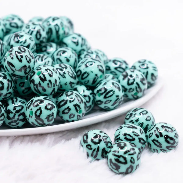 front view of a pile of 16mm Teal Leopard Print Acrylic Bubblegum Jewelry Beads