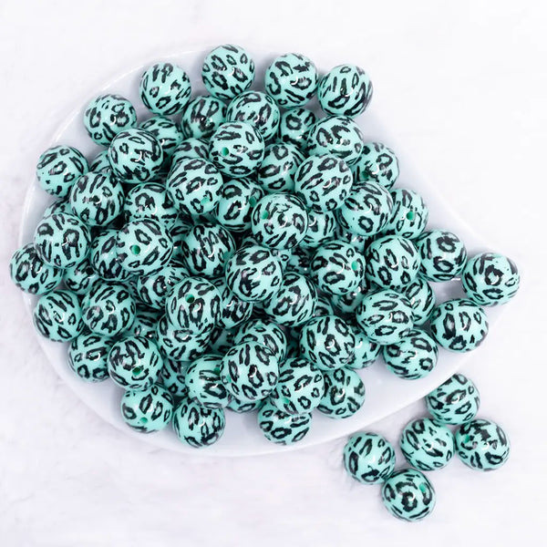 top view of a pile of 16mm Teal Leopard Print Acrylic Bubblegum Jewelry Beads