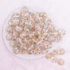 top view of a pile of 16mm White Flaked Flower Bubblegum Bead
